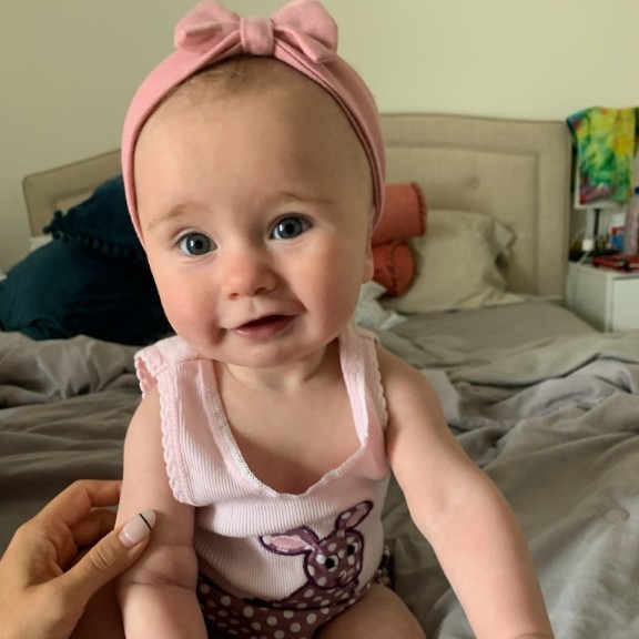 Brian's granddaughter with a pink headband