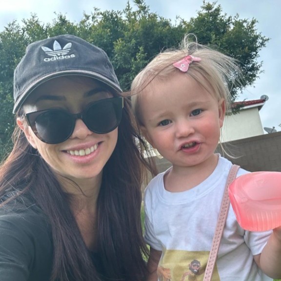 Brian's daughter and granddaughter outdoors
