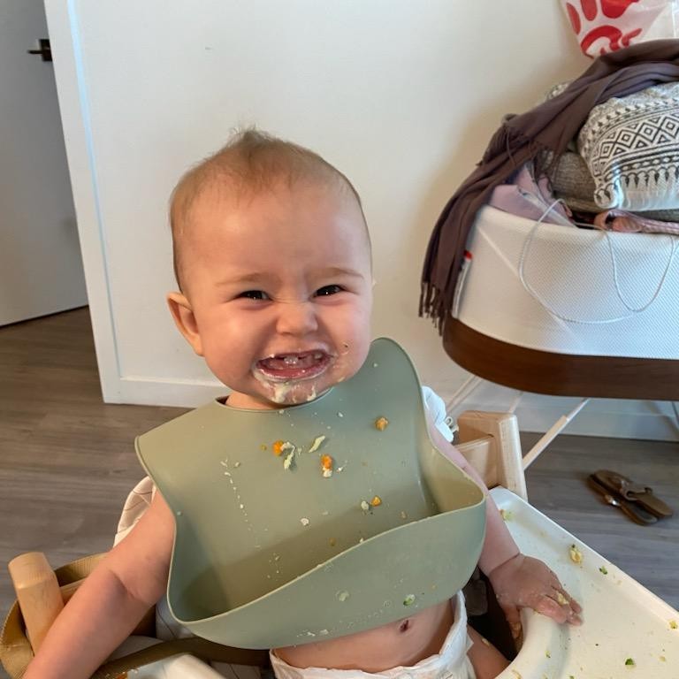 Brian's granddaughter smiling at mealtime